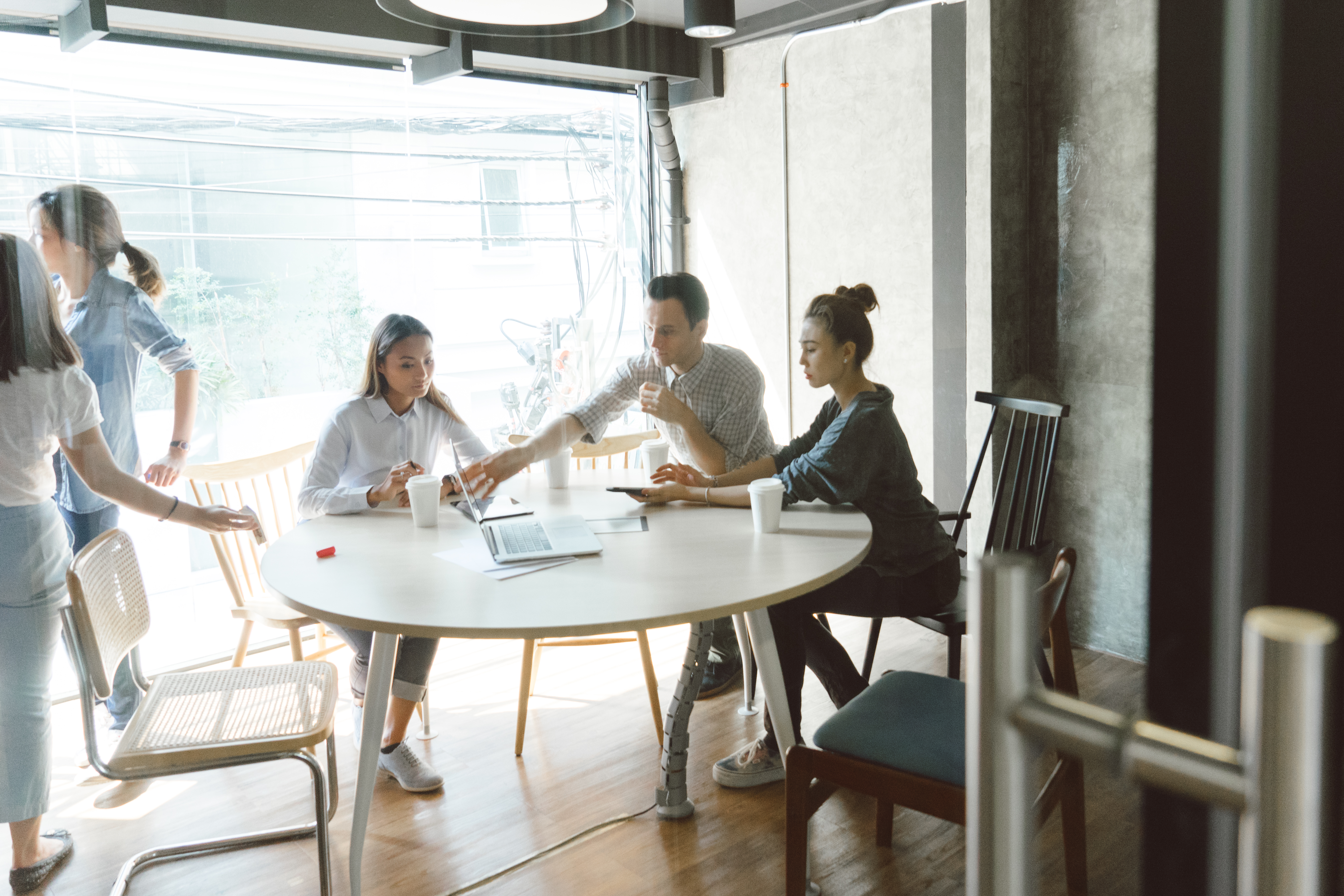 Group of coworkers having a meeting indoors